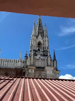 a building with a tower on top of a roof at Hotel Brunette in Santa Ana