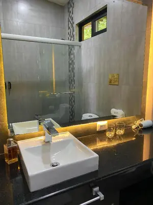 a bathroom with a sink and a mirror at Casa 1800 Cerro Verde in Cerro Verde