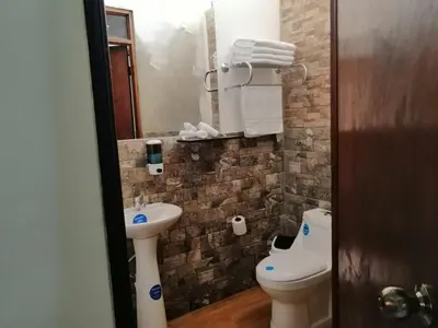 a bathroom with a sink and a toilet at Green life in San Salvador