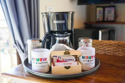 a tray with coffee cups and a blender on a table at Boutike Art & Wellness in Concepción de Ataco