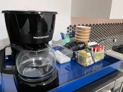 a coffee maker sitting on top of a counter at The Cabins in La Libertad