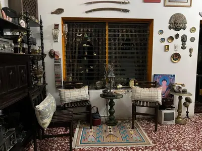 a room with two chairs and a table and a window at Mendoza’s GUEST HOUSE in Santa Ana