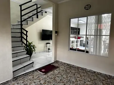a living room with a staircase and a window at A 5 minutos de las Ruinas del Tazumal, Chalchuapa Santa Ana El Salvador in Chalchuapa