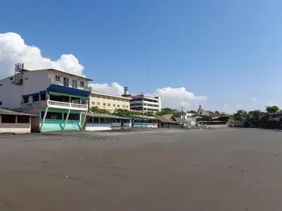 a group of buildings on a beach next to the ocean at Playa El Obispo F La Libertad Playa El Obispo in La Libertad