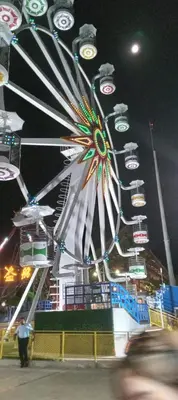 a ferris wheel at a carnival at night at Playa El Obispo F La Libertad Playa El Obispo in La Libertad