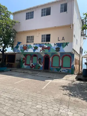 a building with a mural on the side of it at Playa El Obispo B La Marea building La Libertad in La Libertad