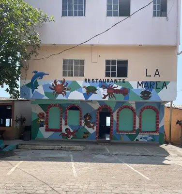 a building with a mural on the side of it at Playa El Obispo B La Marea building La Libertad in La Libertad