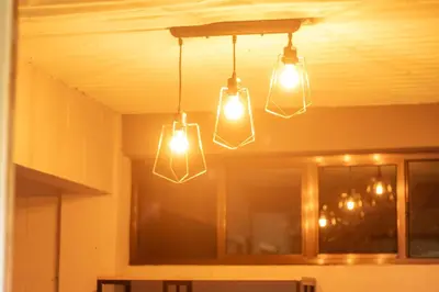 a group of lights hanging from a ceiling at La Canasta in El Zonte