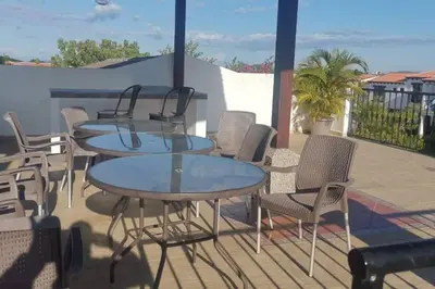 a group of tables and chairs on a patio at Casa llena de naturaleza y paz perfecta para descansar. in San Miguel