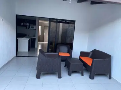 a living room with two chairs and a table at Casa llena de naturaleza y paz perfecta para descansar. in San Miguel