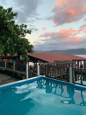 a view of a swimming pool with a cloudy sky at Hotel Silver Lake in Santa Ana