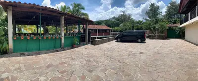 a black van parked in front of a building at Green Canyon in El Jurón