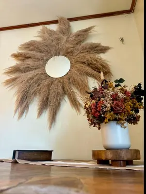 a flower arrangement in a white vase on a table at Cafeto Loft Lovely and private loft in Ruta de las Flores heart in Juayúa