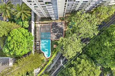 an overhead view of a park with trees and a pool at Cozy, Modern and Centric Apartment with pool and gym in San Salvador