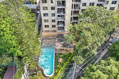 an overhead view of an apartment complex with a swimming pool at Cozy, Modern and Centric Apartment with pool and gym in San Salvador