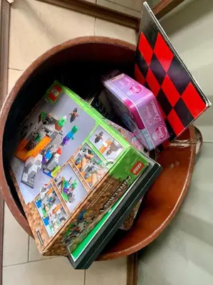 a bowl filled with toys and a laptop on a table at Wabi Sabi , casa de playa in Tamanique