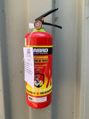 a fire extinguisher is attached to a wall at Wabi Sabi , casa de playa in Tamanique