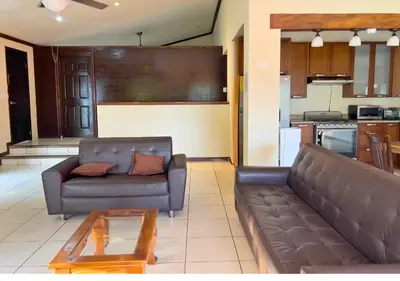 a living room with a couch and a table at Villa Noelia in El Jurón