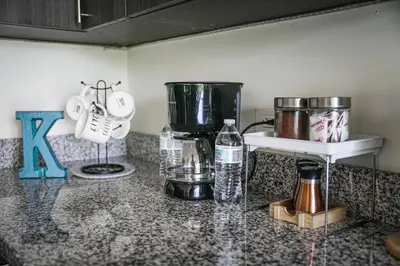 a kitchen counter with a mixer and a blender on it at Avitat Joy City &Volcano View 2Brm Pool &Gym in San Salvador