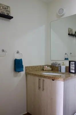 a kitchen with a sink and a counter top at Avitat Joy City &Volcano View 2Brm Pool &Gym in San Salvador