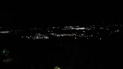 a view of a city lit up at night at PROVENZA en Los Naranjos in Juayúa