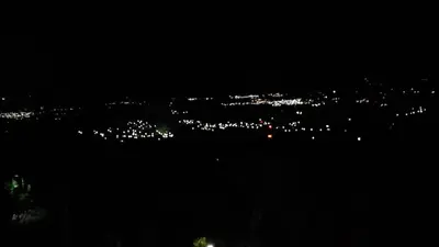 a view of a city lit up at night at PROVENZA en Los Naranjos in Juayúa