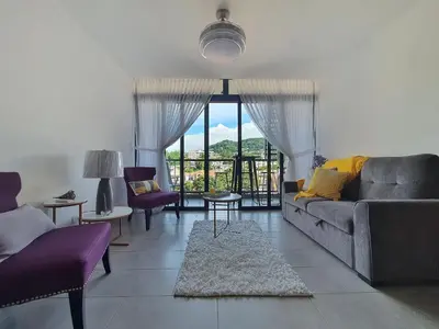 a living room with a couch and some chairs at Avitat Joy Cozy&Homy 2B Flat Private Wifi Pool Gym in San Salvador