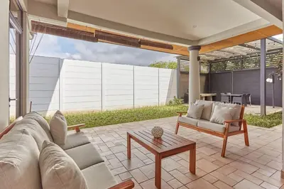 a living room with a couch and a table at New in the heart of the city 5 min to US Embassy in Nuevo Cuscatlán