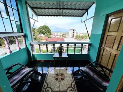 a view from the balcony of a house at Samay Hostel in Juayúa