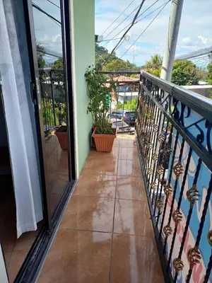 a balcony of a house with a view of a street at Hostal Jasmin in Berlín