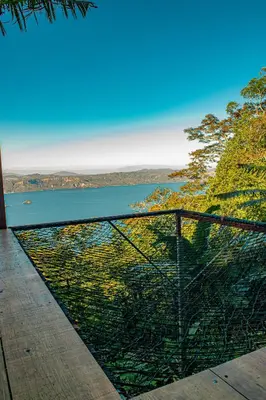 a view of a body of water from a balcony at Tres Piedras in San Francisco Chinameca