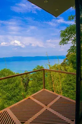 a balcony with a view of the ocean at Tres Piedras in San Francisco Chinameca