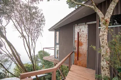 an open door on a house with a wooden porch at Tres Piedras in San Francisco Chinameca