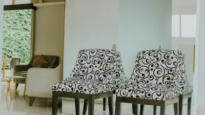 two chairs sitting next to each other in a room at LA RUTA HOTEL CORPORATIVO in San Salvador