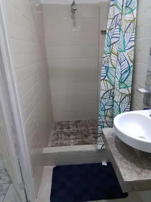 a bathroom with a shower and a sink at Alojamientos Santa Marta La Unión in La Unión