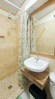 a bathroom with a sink and a toilet and a shower at Alojamientos Santa Marta La Unión in La Unión