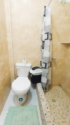 a bathroom with a toilet and a shower at Alojamientos Santa Marta La Unión in La Unión