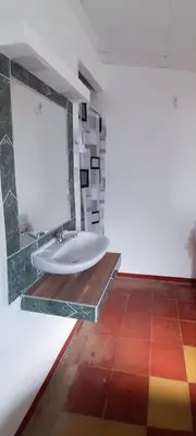 a bathroom with a sink and a mirror at Alojamientos Santa Marta La Unión in La Unión