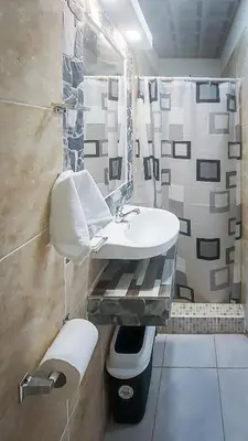 a white bathroom with a sink and a shower at Alojamientos Santa Marta La Unión in La Unión