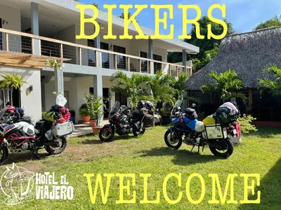 a group of motorcycles parked in front of a house at HOTEL EL VIAJERO in La Libertad