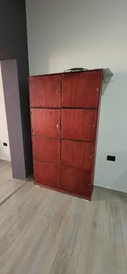 a wooden door in a room with a wooden floor at Altea Hostal in Santa Ana