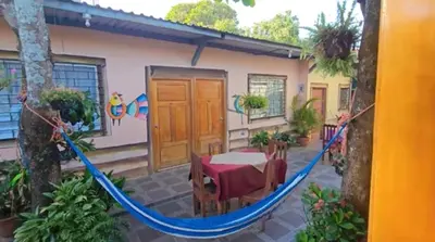 a hammock in the courtyard of a house at Hostal y Restaurante Posada Real in La Palma