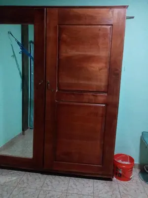 a wooden door in a room with a mirror at Casa Hotel Familiar in San Lucas