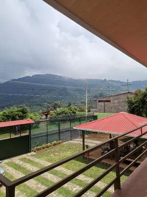 a view from the balcony of a house at Hostal Puertas De Apaneca in Apaneca