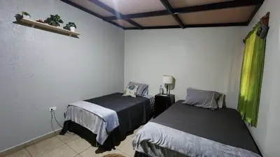 a bedroom with two beds in a room at Bed and breakfast Tía Mema in Santa Ana